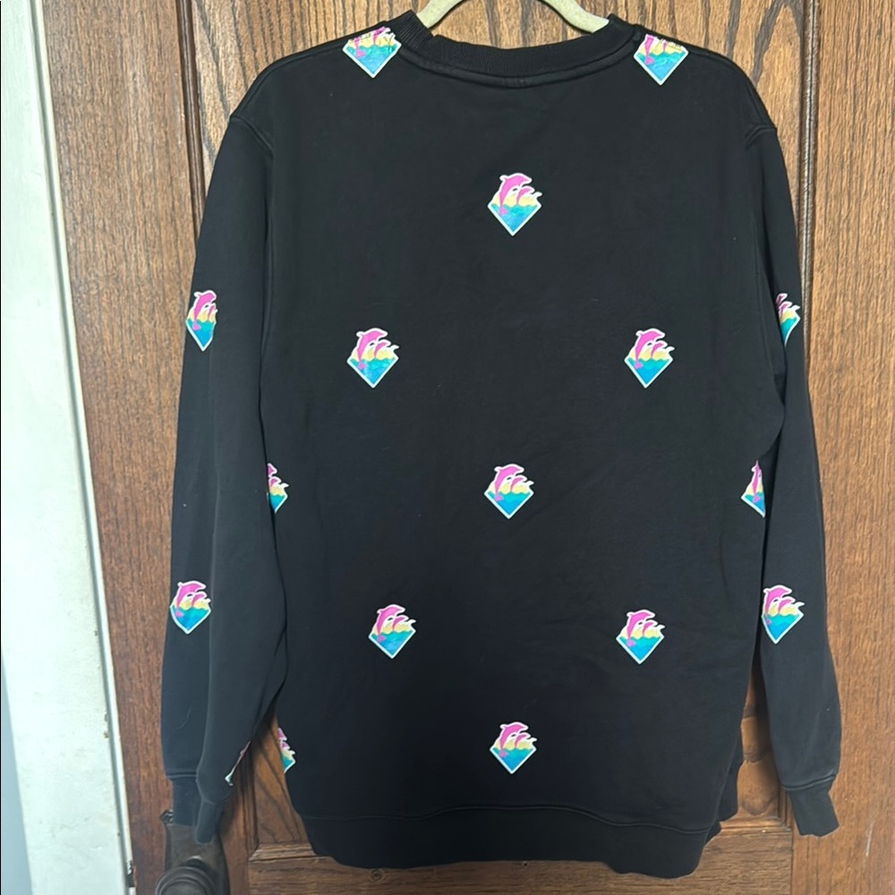 Black sweatshirt with Dolphins on it